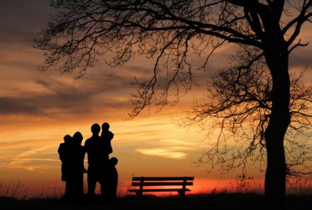 adoptive family watching sunset