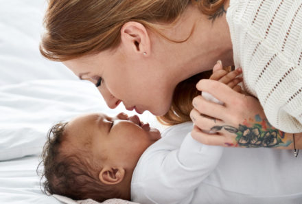 mom kissing baby