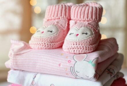 newborn clothes with shoes on top