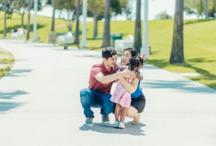 family hugging and smiling